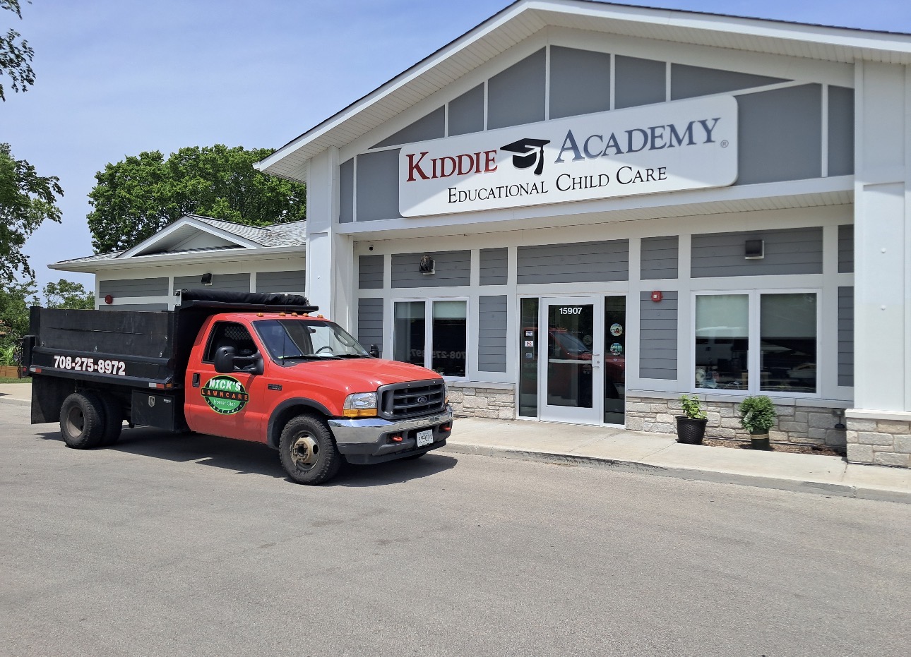 Nick's Lawncare truck servicing a commercial property in Chicagoland